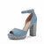 A single women's platform sandal with an ankle strap, featuring a dusty blue suede upper and a textured silver glitter block heel and platform, shown against a plain white background.