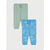 Two pairs of children's sweatpants laid flat on a light gray background. The top pair is a solid pale mint green, and the bottom pair is light blue with a white line-art pattern of construction vehicles.
