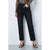 A model wearing black cropped straight-leg jeans, paired with a leopard-print long-sleeve top and black strappy heels, standing against a light gray studio background.