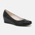 A single black leather wedge pump shoe with a rounded toe and a low wedge heel, shown from a side profile on a light gray background.