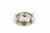 Clear glass bowl with gold handles on a wooden surface