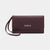 A dark plum purple embossed leather clutch bag with a wrist strap and gold 'bebe' logo on the front, set against a plain light gray background.