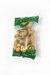 Packaged potatoes with a green label held by a hand on a concrete surface