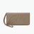 A taupe leather wristlet clutch with an embossed cursive logo on the front, shown on a plain white background.