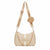 Bebe brand shoulder bag in beige textured leather with a matching beige fabric strap, gold-tone chain detail, and a small matching round pouch, shown on a plain white background.