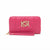 A bright pink quilted zip-around wallet with a matching wristlet strap and a large gold-tone interlocking logo emblem on the front, set against a plain white background.