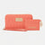 A coral pink quilted wallet and matching wristlet set by Bebe by London, featuring gold-tone hardware and logo details, set against a plain light gray background.