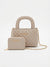 A light beige quilted handbag with a top handle and a matching zip wallet, both featuring gold-tone 'bebe' branding, displayed on a clean white background.