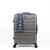 A gray hard-shell spinner suitcase with a blue and white product information tag attached to the side, shown against a plain white background.