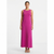 A woman modeling a sleeveless, scoop-neck maxi dress in a vibrant magenta pink, standing against a plain white studio background.