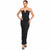 A woman modeling a strapless black ruched maxi dress with a deep V-neckline and fitted silhouette, paired with black heeled sandals, against a plain white background.