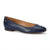 A navy blue leather ballet flat shoe with a low block heel, shown from a side profile on a white background. A small gold monogram logo is visible on the inner heel.