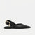 A single black leather slingback flat sandal with a pointed toe and a gold-tone rectangular buckle, shown in profile against a plain white background.