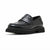 A single black leather loafer with a thick lug sole, featuring a smooth leather upper and a woven braided strap detail across the vamp, shown on a plain white background.