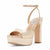 A metallic champagne gold platform sandal with an ankle strap, shown from a three-quarters angle on a white background. The brand name 'Steve Madden' is visible on the insole.