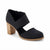 A single women's heeled shoe in black canvas-like fabric with a wide elastic ankle strap and a chunky wooden block heel, shown on a white background.