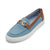 A light blue canvas loafer-style slip-on shoe with brown leather trim, a gold-tone metal buckle detail on the vamp, and a white rubber sole, shown on a plain white background.