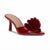 A single red patent leather mule sandal with a pointed toe, a sculptural layered flower-like embellishment on the vamp, and a mid-height stiletto heel, shown against a plain white background.