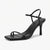 Maroon high-heeled shoes with thin straps on a white background