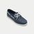 A single navy blue boat shoe with white laces and white stitching, shown from a three-quarters angle on a light gray background.