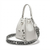 A white pebbled leather Karl Lagerfeld bucket bag with silver-tone hardware, featuring a matching white leather top handle and a wide black-and-white printed shoulder strap with 'KARL LAGERFELL' text.