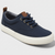 Navy blue sneaker with white sole on a light gray background