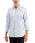 Man wearing a light blue button-up shirt with rolled-up sleeves on a white background