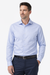 Man wearing a light blue dress shirt and dark pants on a white background