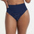 A close-up of a model wearing high-waisted navy blue underwear with a subtle tonal lace pattern on the front, set against a plain white background.