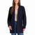 A woman wearing a navy blue ribbed open-front cardigan over a beige top and blue jeans, shown against a plain white background.