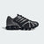 Black and silver athletic shoes on a light gray background