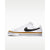 A white Nike low-top sneaker with a black Swoosh, a gold midsole stripe, and a white rubber sole, shown from a side profile view against a light gray background.