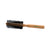Round wooden hairbrush with black bristles on a white background