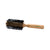 Hairbrush with black bristles and wooden handle on a white background