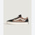 A single Vans platform sneaker featuring a black suede toe and heel, a leopard print canvas side panel, white laces, and a thick white platform sole.