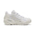 White sneaker with green accents on a white background