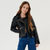 Person wearing a black leather jacket and blue jeans on a white background