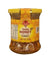 Jar of Queen Bee pure honey on a white background