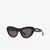 Black cat-eye sunglasses with dark lenses and a small gold-tone logo detail on the temple arm, shown against a plain white background.
