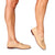Beige leather penny loafers with gold-tone horsebit hardware, shown on a model's feet against a white background.