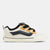 White sneaker with black and yellow accents on a white background