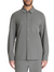 Man wearing a gray button-up shirt with a pocket on a white background