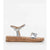 A single metallic silver T-strap sandal with a cork wedge sole, shown in profile against a white background.