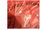 A close-up of a red plastic bag containing Super Hero Charcoal, with black printed text and a flame graphic on the front.