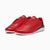 A pair of red low-top sneakers with white soles, shown from a three-quarters angle on a light gray background.
