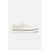A classic low-top sneaker in off-white canvas with white laces, a white side stripe, and a black stripe along the midsole, shown from a side profile view against a light gray background.