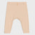 A pair of baby leggings in a light peach-beige color, featuring a ribbed texture, a buttoned waistband, and a small side tag, shown against a light gray background.