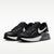 A pair of Nike Air Max sneakers in black and white, featuring a black mesh and leather upper with a prominent white Swoosh and white midsole.