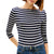 Woman wearing a navy and white striped long-sleeve shirt with a brand logo.