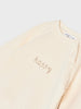 Beige long-sleeve shirt with 'happy' embroidery on a light gray background